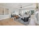 Bright living room with large windows, hardwood floors, and neutral color palette at 14642 Sorrel Dr, Broomfield, CO 80023