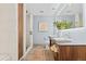 Well-lit bathroom with a double sink vanity, modern fixtures, shower, tub, and contemporary design at 1630 N Clarkson St # 110, Denver, CO 80218