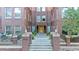 Attractive brick apartment building with manicured landscaping and inviting entrance steps at 1630 N Clarkson St # 110, Denver, CO 80218