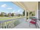 Inviting covered front porch with outdoor seating, perfect for relaxing and enjoying the neighborhood view at 7902 E 49Th Pl, Denver, CO 80238