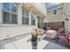 Charming patio with stylish seating, a flower pot, and an inviting atmosphere for outdoor relaxation at 7902 E 49Th Pl, Denver, CO 80238