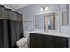 Updated bathroom features a modern vanity and shower/tub combo at 8378 S Upham Way # B205, Littleton, CO 80128
