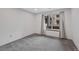 Bright bedroom with neutral carpet, paint, and window with natural light at 8378 S Upham Way # B205, Littleton, CO 80128