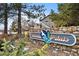 The community sign is set in a landscape of mature trees and evergreens at 8378 S Upham Way # B205, Littleton, CO 80128