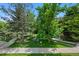 Community green space features mature trees, picnic tables, and walking trails at 8378 S Upham Way # B205, Littleton, CO 80128