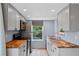 Updated kitchen with stainless appliances and butcher block countertops at 8378 S Upham Way # B205, Littleton, CO 80128