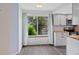 Bright kitchen features wood countertops, stainless appliances, neutral color palette, and large window for natural light at 8378 S Upham Way # B205, Littleton, CO 80128