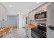 Updated kitchen with stainless appliances and butcher block countertops at 8378 S Upham Way # B205, Littleton, CO 80128