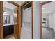 Convenient in-unit washer and dryer are located between the bathroom and bedroom at 8378 S Upham Way # B205, Littleton, CO 80128