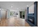 Open living space with hardwood floors, fireplace, and easy kitchen access at 8378 S Upham Way # B205, Littleton, CO 80128