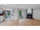 Living area featuring hardwood floors, fireplace, and sliding door to balcony at 8378 S Upham Way # B205, Littleton, CO 80128