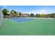 The community tennis court has condos in the background at 8378 S Upham Way # B205, Littleton, CO 80128
