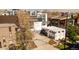 A street-level perspective shows the architecture of the home and its integration with surrounding greenery and neighborhood ambiance at 1749 Boulder St, Denver, CO 80211