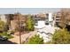 A street-level shot showcases the property's modern design and landscaping, blending with neighboring homes and mature trees at 1749 Boulder St, Denver, CO 80211