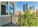 Balcony with view of neighboring buildings and lush trees at 290 W 12Th Ave # 401, Denver, CO 80204