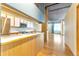 Modern kitchen with stainless steel appliances and wood cabinets at 290 W 12Th Ave # 401, Denver, CO 80204