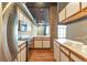 Modern kitchen with stainless steel appliances and wood cabinets at 290 W 12Th Ave # 401, Denver, CO 80204