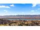Beautiful aerial view featuring a serene lake and lush green spaces, highlighting the tranquil setting of the property at 3663 S Sheridan Blvd # I8, Denver, CO 80235