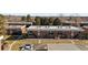 Aerial view showcasing a complex of buildings with parking and landscaping at 3663 S Sheridan Blvd # I8, Denver, CO 80235