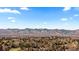 Expansive aerial view showcasing the community's scenic location with majestic mountains in the background at 3663 S Sheridan Blvd # I8, Denver, CO 80235