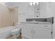 Updated bathroom with granite vanity and neutral tile at 3663 S Sheridan Blvd # I8, Denver, CO 80235