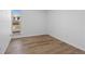 Bedroom with window and laminate flooring at 3663 S Sheridan Blvd # I8, Denver, CO 80235