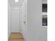 Bright entryway with a white door, closet and wood flooring at 3663 S Sheridan Blvd # I8, Denver, CO 80235