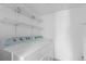Laundry area with side-by-side Whirlpool washer and dryer at 3663 S Sheridan Blvd # I8, Denver, CO 80235