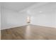 Bright living room with light colored laminate flooring at 3663 S Sheridan Blvd # I8, Denver, CO 80235