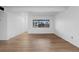 Living room features laminate flooring and an exterior view at 3663 S Sheridan Blvd # I8, Denver, CO 80235