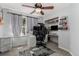 Bedroom with custom built-in desk, marble cabinetry and modern fixtures at 16257 E 105Th Cir, Commerce City, CO 80022