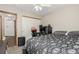 Bedroom with carpet flooring, ceiling fan, and closet space at 16257 E 105Th Cir, Commerce City, CO 80022