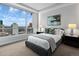 Bedroom features a large window with city views, and comfortable styling at 2001 Lincoln St # 1811, Denver, CO 80202