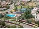 Stunning aerial view of a community featuring a pool, tennis courts, and well-maintained green spaces at 9629 Silent Hills Ln, Lone Tree, CO 80124