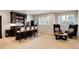 Wet bar with seating and wine storage, plus cozy sitting area by window at 9629 Silent Hills Ln, Lone Tree, CO 80124