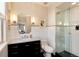 Well-lit bathroom showcasing a sleek vanity, white subway tile, and a glass shower, creating a clean and modern space at 9629 Silent Hills Ln, Lone Tree, CO 80124