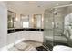 Elegant bathroom boasting double sinks, white cabinetry, a modern shower, and contemporary design at 9629 Silent Hills Ln, Lone Tree, CO 80124