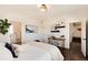 Charming bedroom offering hardwood floors, adjacent bathroom access, and a quaint work space, ideal for a tranquil living at 9629 Silent Hills Ln, Lone Tree, CO 80124