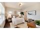Inviting bedroom featuring natural light, hardwood floors, and a cozy desk area, perfect for relaxation and productivity at 9629 Silent Hills Ln, Lone Tree, CO 80124