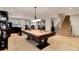 Spacious game room features a pool table, recessed lighting, and access to stairs at 9629 Silent Hills Ln, Lone Tree, CO 80124