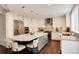 Gourmet kitchen featuring stainless steel appliances, granite countertops, and a large island with bar seating at 9629 Silent Hills Ln, Lone Tree, CO 80124