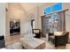 Bright living room featuring a tall ceiling, large window, with home office in view at 9629 Silent Hills Ln, Lone Tree, CO 80124