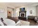Cozy main bedroom featuring a fireplace, TV, and an elegant dresser for storage at 9629 Silent Hills Ln, Lone Tree, CO 80124