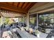 Extensive covered patio with multiple seating and dining areas, offering stunning views at 9629 Silent Hills Ln, Lone Tree, CO 80124