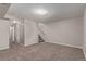 Open basement layout with stairs, ideal for a home office or entertainment zone at 18577 E Whitaker Cir # C, Aurora, CO 80015