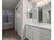 Bright bathroom featuring white cabinets and new vanity at 18577 E Whitaker Cir # C, Aurora, CO 80015