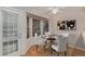 Charming dining room featuring bay window, modern lighting and decor at 18577 E Whitaker Cir # C, Aurora, CO 80015