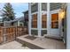 Townhome exterior with white bay window, adjacent to a privacy fence at 18577 E Whitaker Cir # C, Aurora, CO 80015