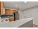 Well-lit kitchen features stainless steel appliances and white countertops at 18577 E Whitaker Cir # C, Aurora, CO 80015