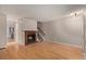 Cozy living room featuring a fireplace, hardwood floors, and stairway access at 18577 E Whitaker Cir # C, Aurora, CO 80015